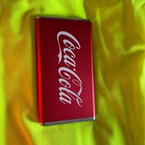 Coca-Cola Orange and Silver Device